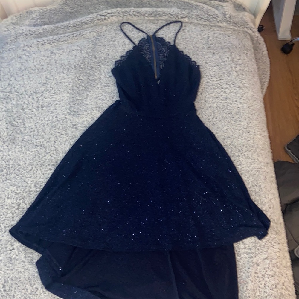 Dress is from Windsor. Dark sparkly blue. lower in the front and longer in back.